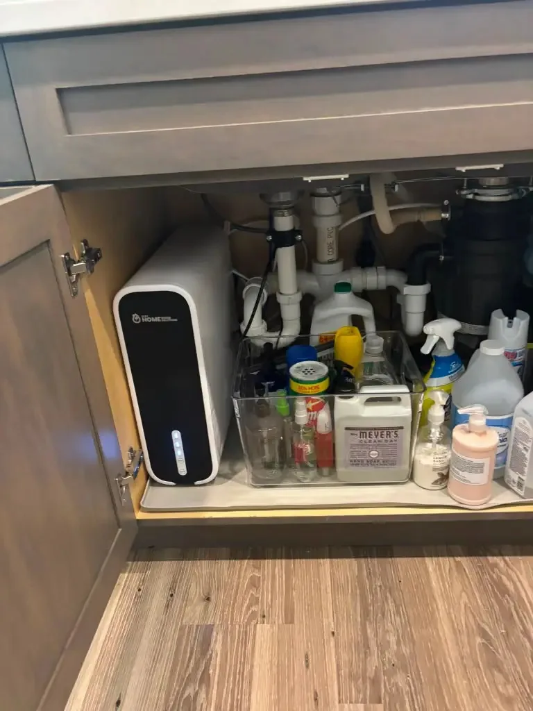 Under-sink reverse osmosis drinking water system installed in a Sarasota, Florida kitchen cabinet
